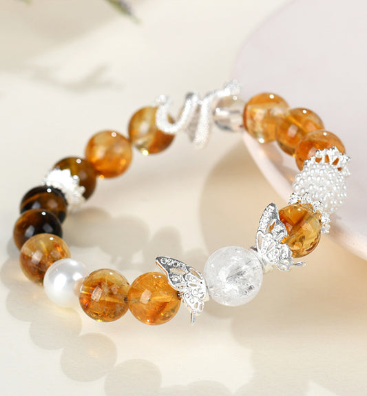 Yellow Quartz with Tiger’s Eye and a serpent motif bracelet